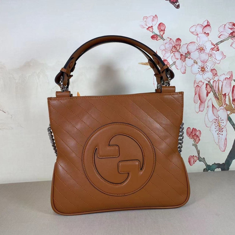 G*u*i top handle bags